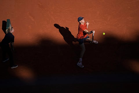 Jannik Sinner returns the ball to Spain's Carlos Alcaraz